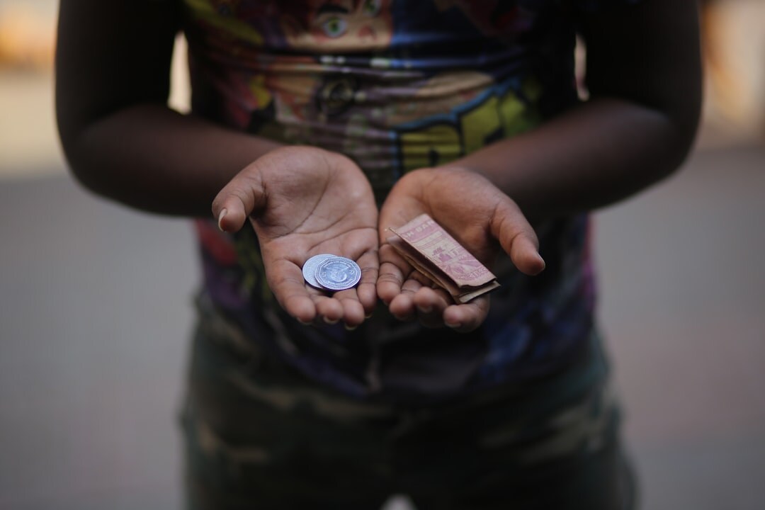 hands holding donation