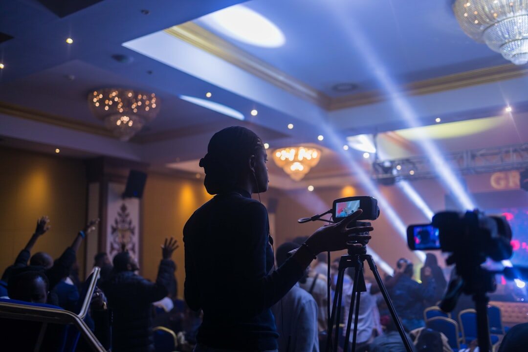 Photographers covering a red carpet celebrity event at night