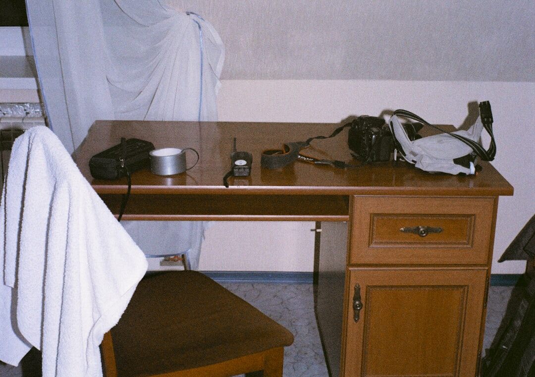 Desk covered with documents and a magnifying glass for fact-checking